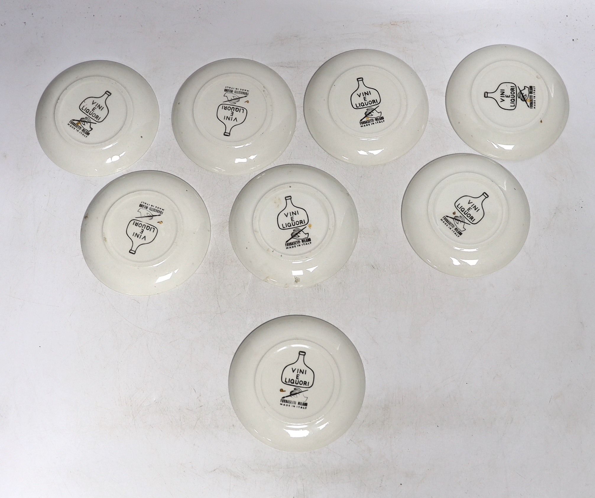 A set of eight Fornasetti ‘Vini e Liquori’ coasters, 1960's, 10cm in diameter